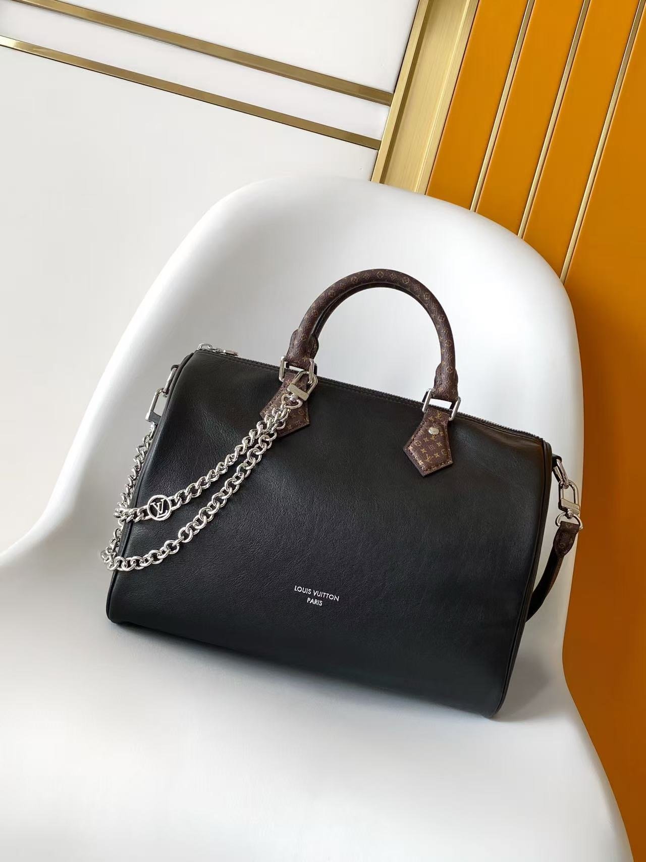 Louis Vuitton Speedy Soft 30 handbag in black cowhide leather with silver-toned hardware