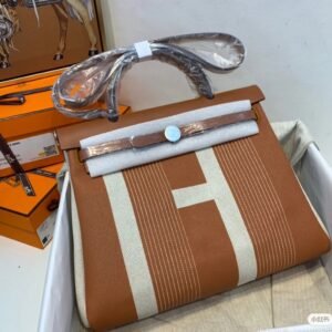 Hermès Herbag Zip 31 in Fauve and Ecru Vibration Canvas with Palladium Hardware.