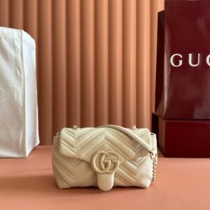 Gucci GG Marmont small matelassé shoulder bag featuring chevron quilted leather