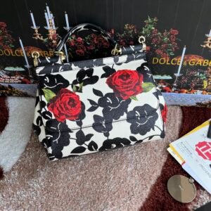 Dolce & Gabbana Medium Sicily bag in a black and white floral print with red roses.