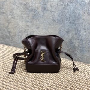 Saint Laurent Jamie mini drawstring shoulder bag in bordeaux lambskin leather.