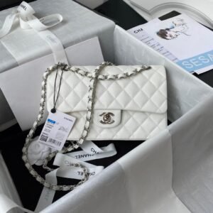 This Chanel Classic Flap bag features white quilted leather and a silver-tone chain strap